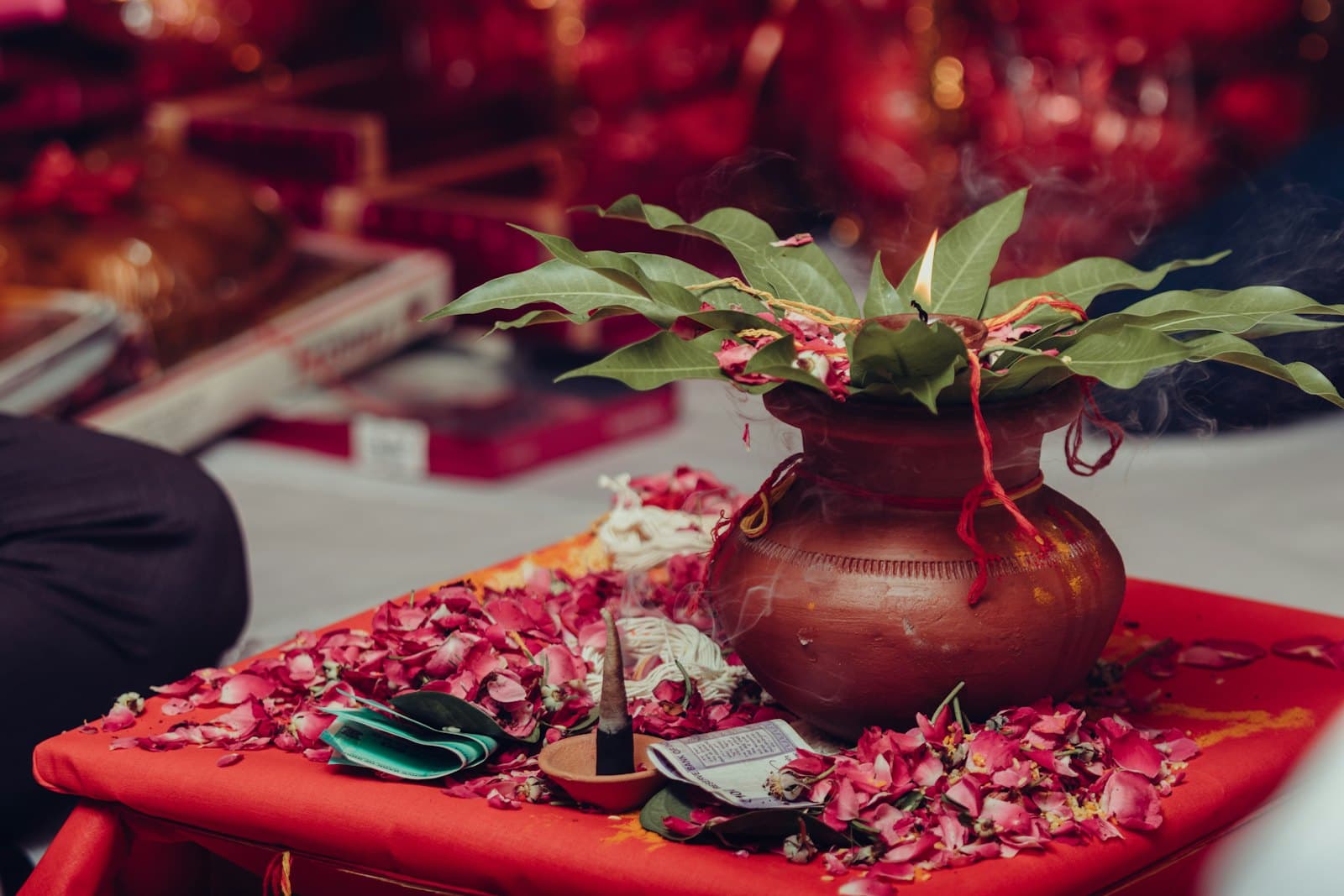 A floral centrepiece on a laid banquet table.